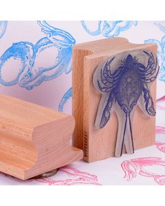 big stamp with animal illustration made in wood handle