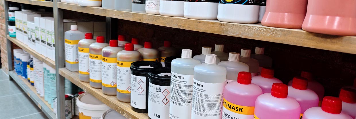Chemicals, emulsions and screen printing products on the shelves of our Rittagraf store in Barcelona.